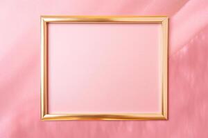 Golden frame on pink abstract background. photo