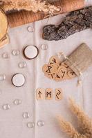 Fortune telling on three Scandinavian runes on the table top and vertical view photo