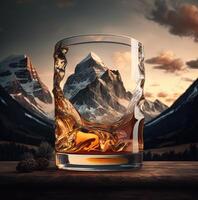 Glass of whiskey on mountain landscape background. photo