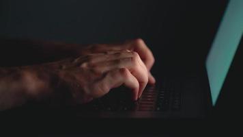 Hands or man office worker typing on the keyboard at night video