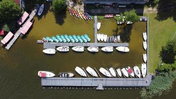 Aerial view of boats moored to a pier in the city. Photo from drone.