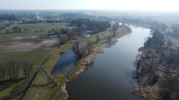 Aerial view of the river in the countryside. Spring landscape. River with trees view from drone. photo