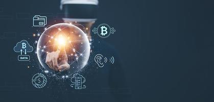 New metaverse with icon business concept,Business hand holding a virtual globe with financial icons future technology, business goals, online communication,graph Screen Icon of a media screen,big data photo