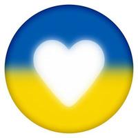 round button with shining heart on painted Ukrainian flag photo