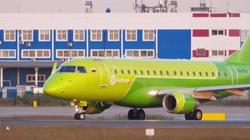 NOVOSIBIRSK, RUSSIAN FEDERATION JUNE 17, 2020 - S7 Airlines Embraer 170SU VQ BYM taxiing to start position before departure with cargo terminal on the background. Tolmachevo Airport, Novosibirsk. video