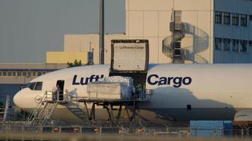 FRANKFURT AM MAIN, GERMANY JULY 18, 2017 - Cargo loading to Lufthansa Cargo McDonnell Douglas MD 11 airfreighter video