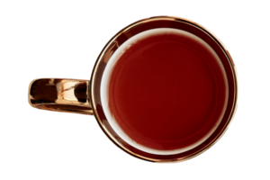 Gold cup with red tea isolated on a transparent background png