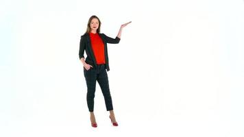 Woman in the studio on a white background shows gestures. Copyspace for text video