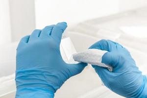 Scientist preparing slides with tissue samples for immunohistochemistry assay in the laboratory. photo