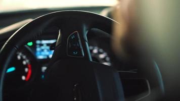 Close-up view of the male hands on the steering wheel driving the car video