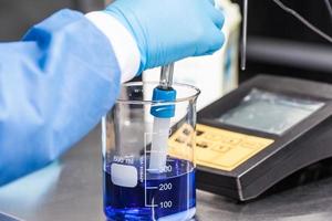 Scientist using a ph meter at laboratory photo