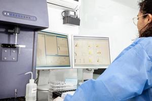 Scientist performing a flow cytometric analysis in the laboratory. Flow cytometer. photo