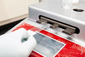 Scientist preparing microscope slides with liquid based cytology method for pap smear test. Cervical cancer concept. Medical concept. photo