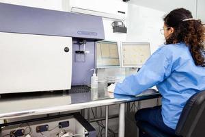 Scientist performing a flow cytometric analysis in the laboratory. Flow cytometer. photo