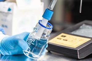 Scientist using a ph meter at laboratory photo