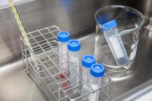 Falcon tubes and rack in a hot water bath at laboratory photo