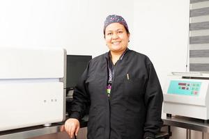 Female scientist working at the laboratory with a thermal cycler. Polymerase chain reaction technique. PCR technique photo