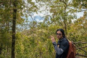 Man got journey on the forest going to peak mountain on Semarang Central Java. The photo is suitable to use for adventure content media, nature poster and forest background.