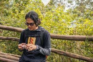 Man got journey on the forest going to peak mountain on Semarang Central Java. The photo is suitable to use for adventure content media, nature poster and forest background.