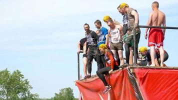 NOVOSIBIRSK, RUSSIAN FEDERATION JUNE 23, 2018 - Race of Heroes project on the polygon of the highest military command school. Athletes jumps in water from 4 meters height video