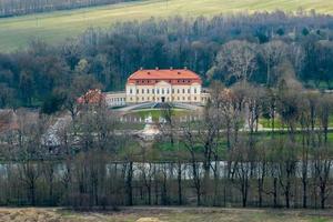 aerial view on overlooking restoration of the historic castle or palace near lake photo