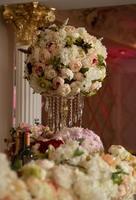 Festive decoration of the banquet with flowers. Bouquets of roses in delicate colors. photo