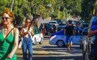 Puerto Escondido Oaxaca 2023 Colorful tourist street people stores restaurants bar La Punta Zicatela. photo