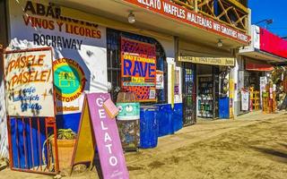 Puerto Escondido Oaxaca 2023 Colorful tourist street people stores restaurants bar La Punta Zicatela. photo