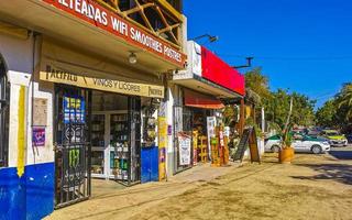 Puerto Escondido Oaxaca 2023 Colorful tourist street people stores restaurants bar La Punta Zicatela. photo