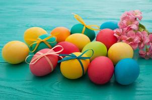 colorful easter eggs top view on blue chalkboard copy space photo