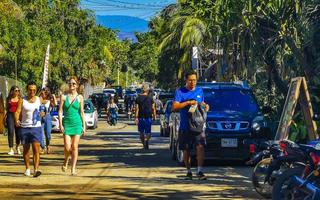 Puerto Escondido Oaxaca 2023 Colorful tourist street people stores restaurants bar La Punta Zicatela. photo