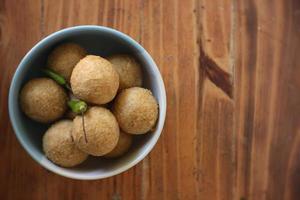 tahu pong is a kind of hollow fried tofu fried tofu which is cut into small rounds. On a white plate. Indonesian street food. photo
