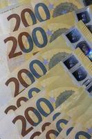 200 euro banknotes european bill cash money isolated on black background two hundred euro close up modern high quality instant stock print photo