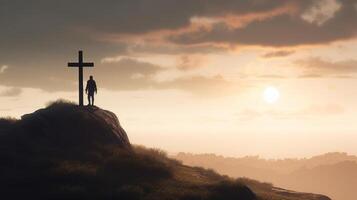 Silhouette of a man standing on a mountain with a cross. artwork photo