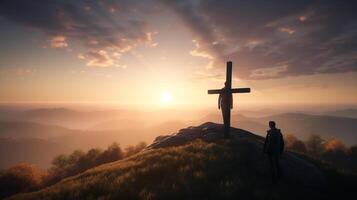 Silhouette of a man standing on a mountain with a cross. artwork photo