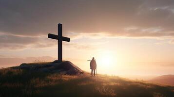 Silhouette of a man standing on a mountain with a cross. artwork photo