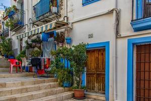 historic old colorful houses Barrio Santa Cruz Alicante Spain on a sunny day photo