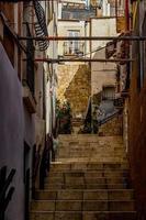 historic old colorful houses Barrio Santa Cruz Alicante Spain on a sunny day photo