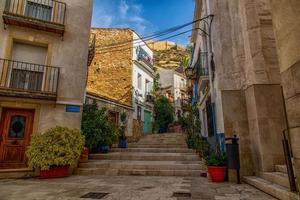 historic old colorful houses Barrio Santa Cruz Alicante Spain on a sunny day photo