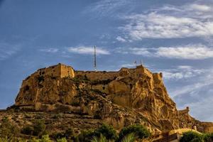 castle of saint barbara in alicante spain against blue sky landmark photo