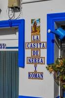 historic old colorful houses Barrio Santa Cruz Alicante Spain on a sunny day photo