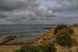 landscape of the seafront of Alicante Spain on a warm sunny autumn day photo