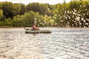 Fisherman in a boat photo