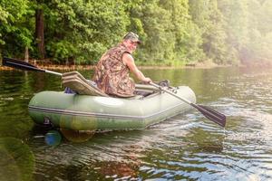 Fisherman in a boat photo