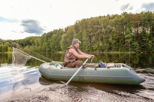 Fisherman in a boat photo