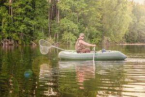 Fisherman in a boat photo