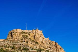 castle of saint barbara in alicante spain against blue sky landmark photo