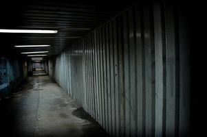 abandoned urban underground passage with graffiti on the wall photo