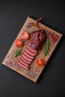 Delicious duck fillet or breast grilled or smoked with spices and salt photo