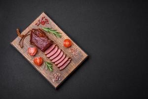 Delicious duck fillet or breast grilled or smoked with spices and salt photo